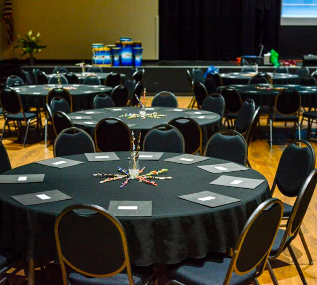 The Amberley room decorated with black tablecloths.