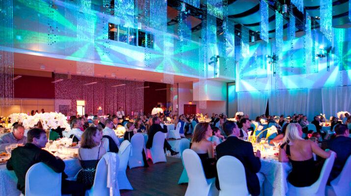 Blue projections at a business event.