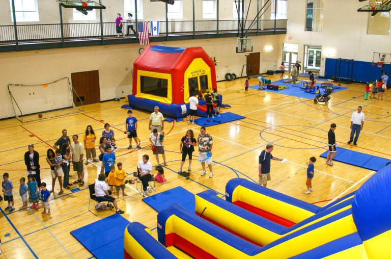 An indoor event with a bouncy house.