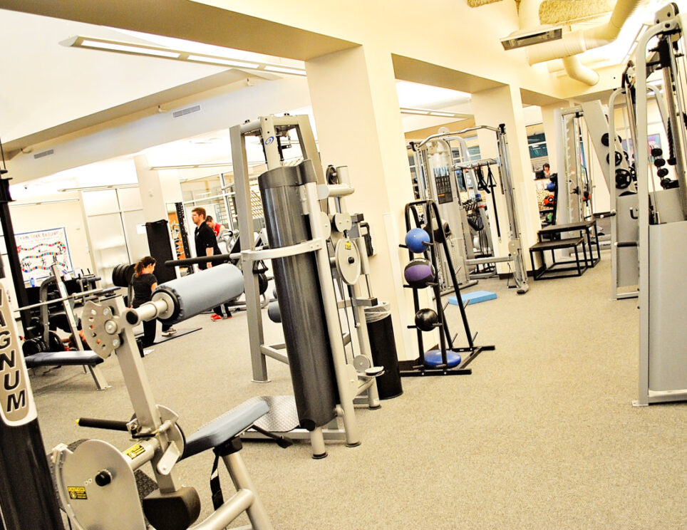 A gym with various weights and fitness equipment.