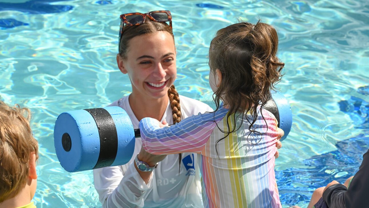 Instructor teaching swim lessons