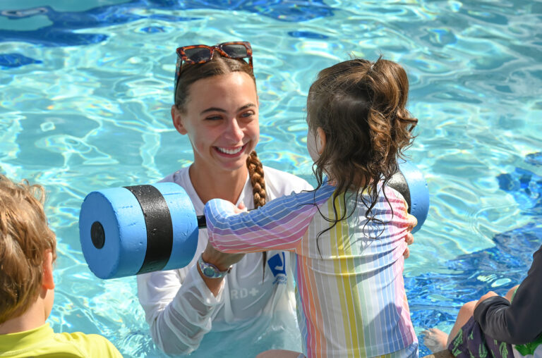 Instructor teaching swim lessons