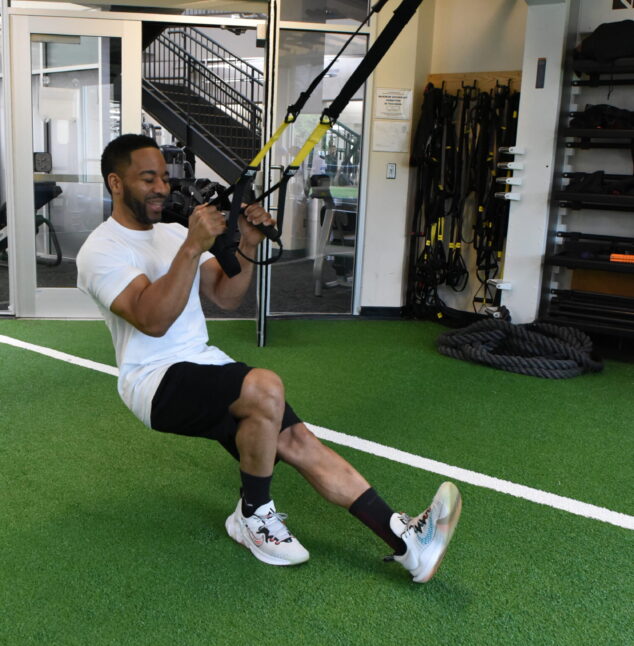 Person working out on TRX