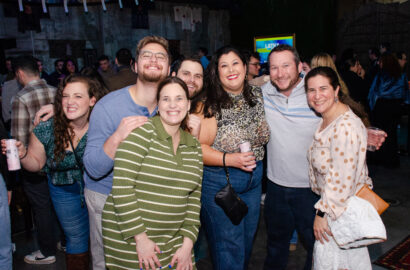 Young adults smiling at a party