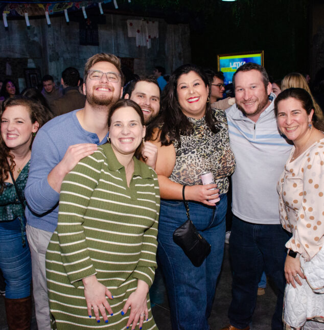 Young adults smiling at a party