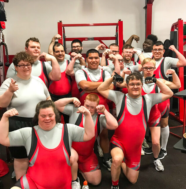 A wrestling team in red uniforms.