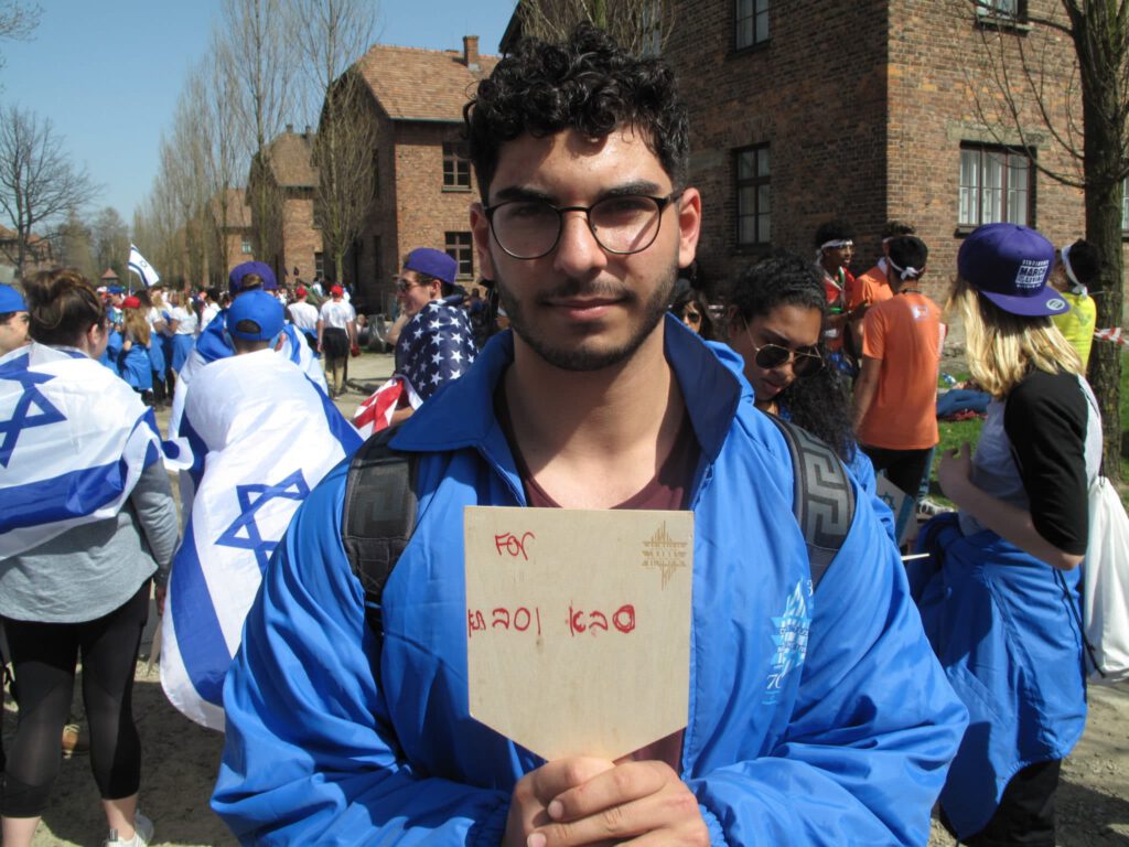 March of the Living participant with sign
