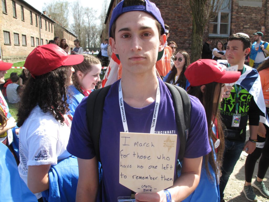 March of the Living participant with sign