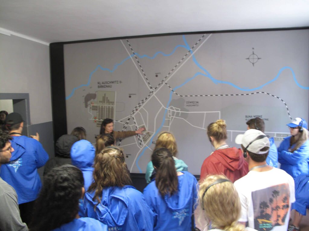 Visitors look at a historical map