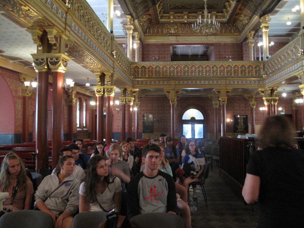 People sitting inside the synagogue