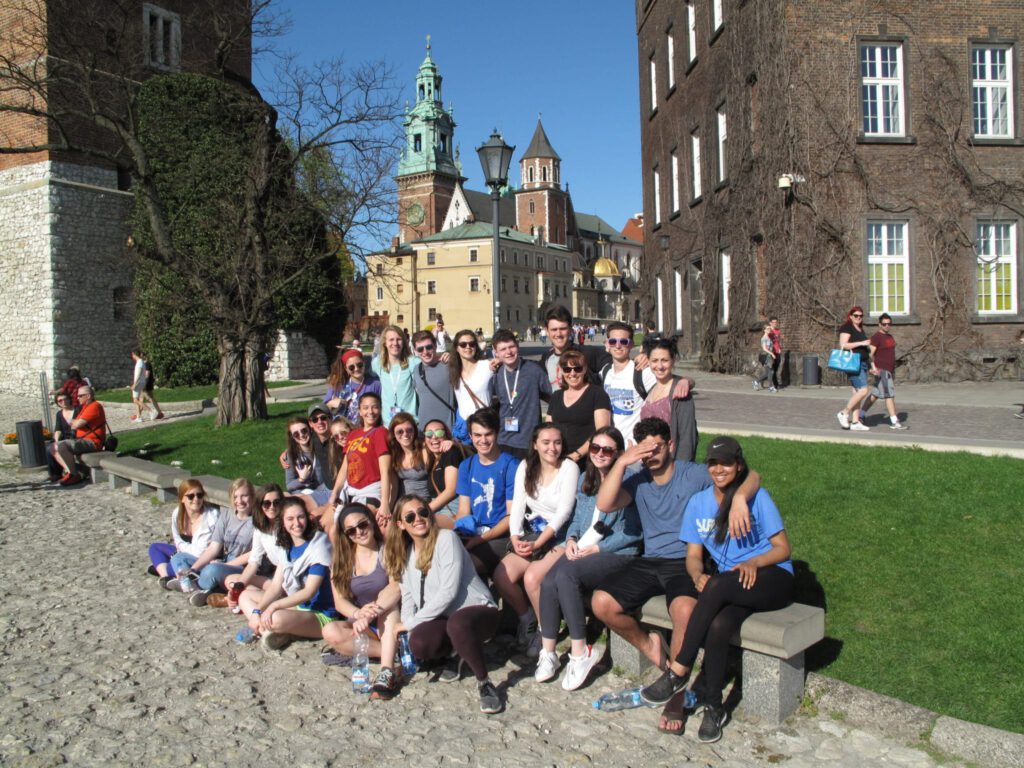 Travelers pose for a group picture