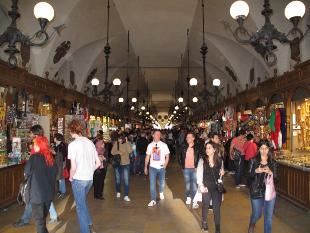 Travelers walk through a market