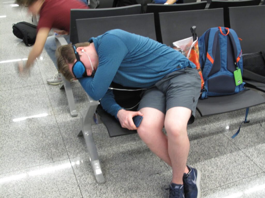 A man sleeping at the airport
