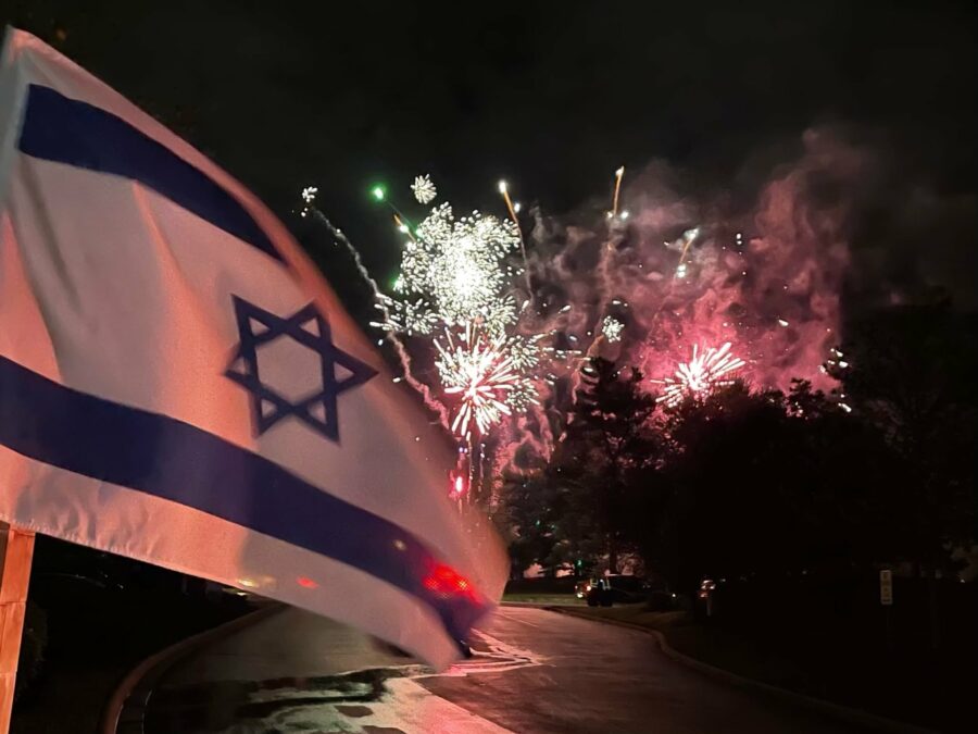 Israeli Flag in front of fireworks