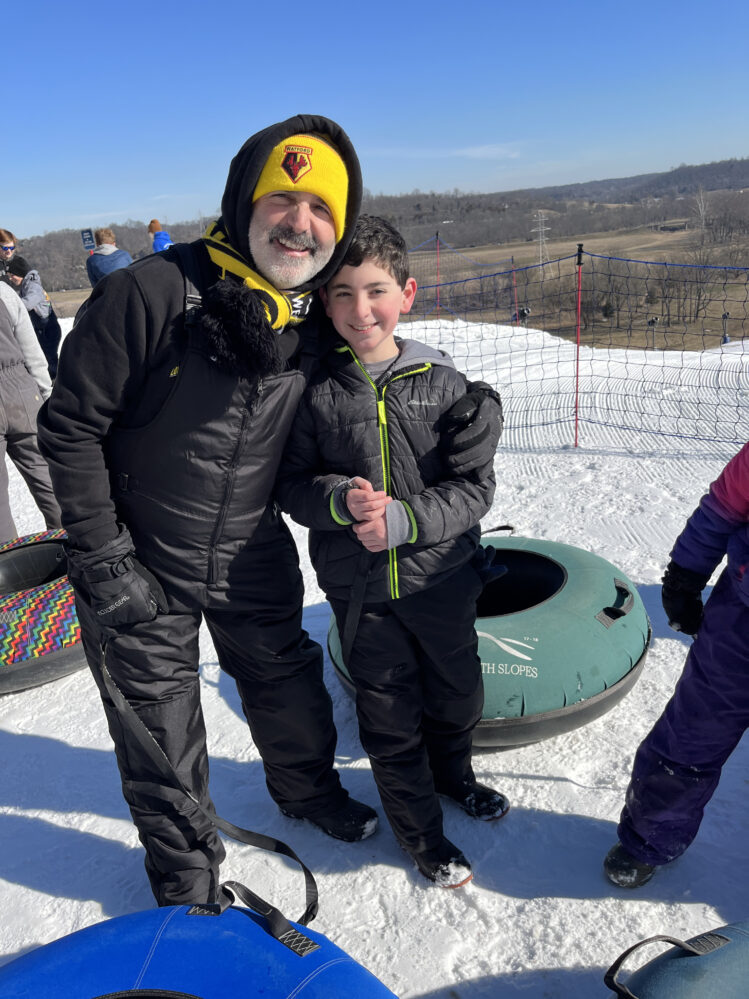Parent and child snow tubing