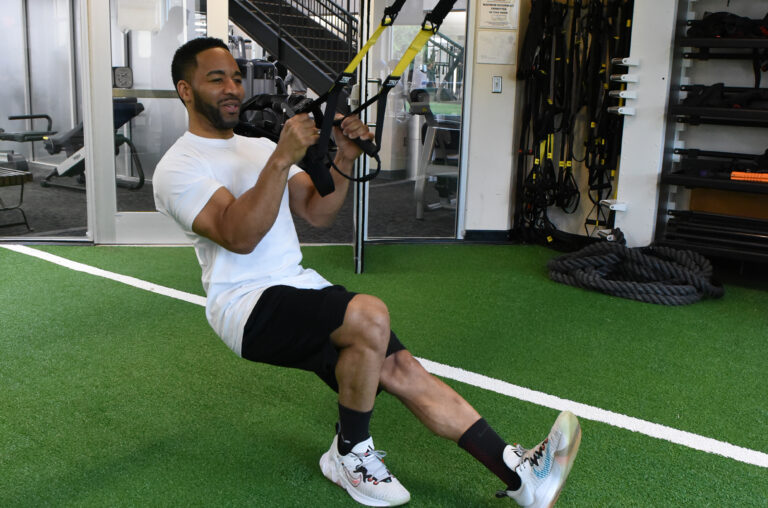 Kareem working on the TRX straps