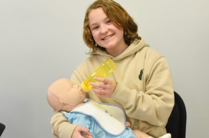 Teen at babysitting class