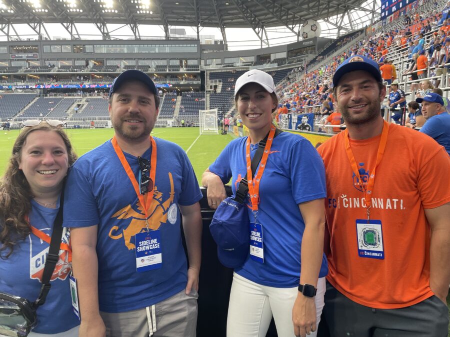 Friends smiling at the FC Cincinnati game.