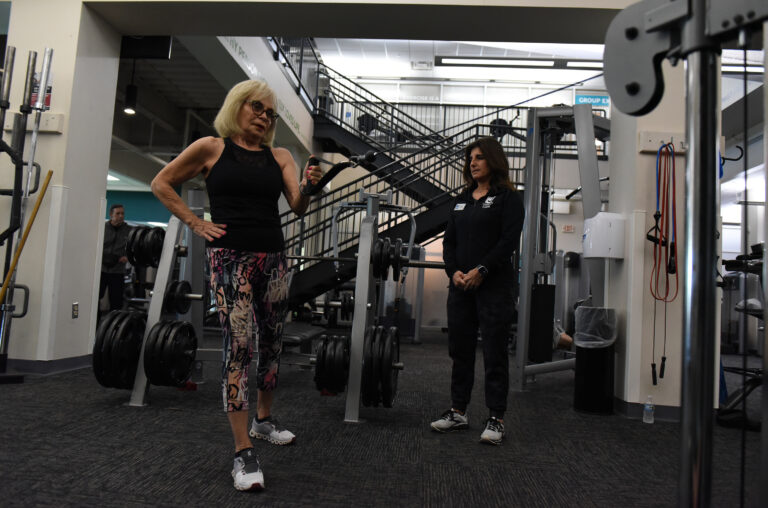 Someone working out with trainer