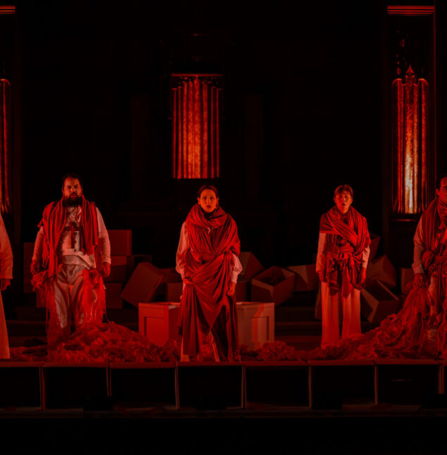 People standing together with a red hue over them