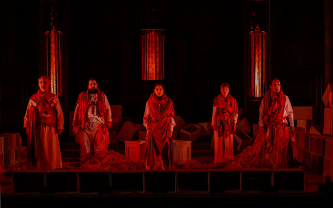 People standing together with a red hue over them