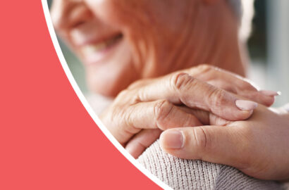 Older woman with hand on her shoulder