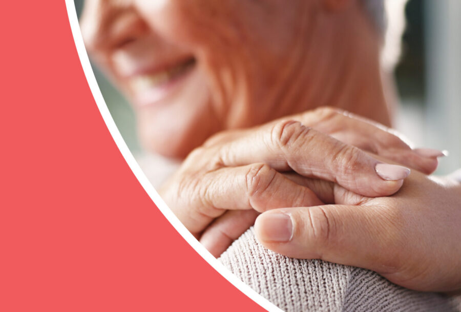 Older woman with hand on her shoulder