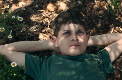 Kid looking up at the sky