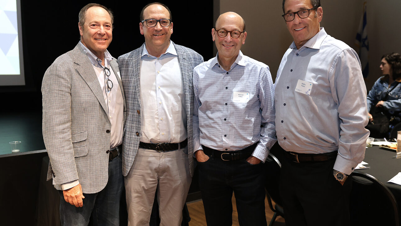 Marc Fisher standing with his brothers