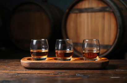 Three bourbon glasses on a table