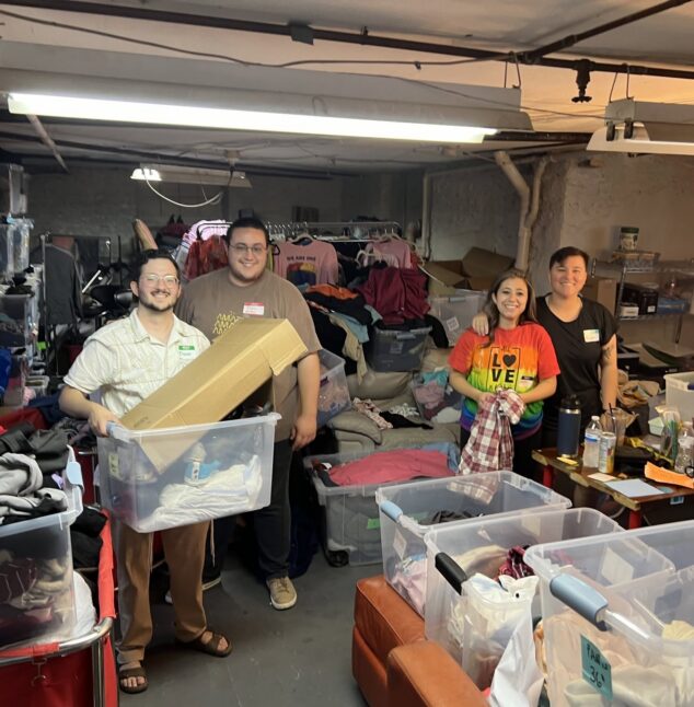 People helping sort clothes