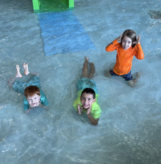 Kids swimming in a pool